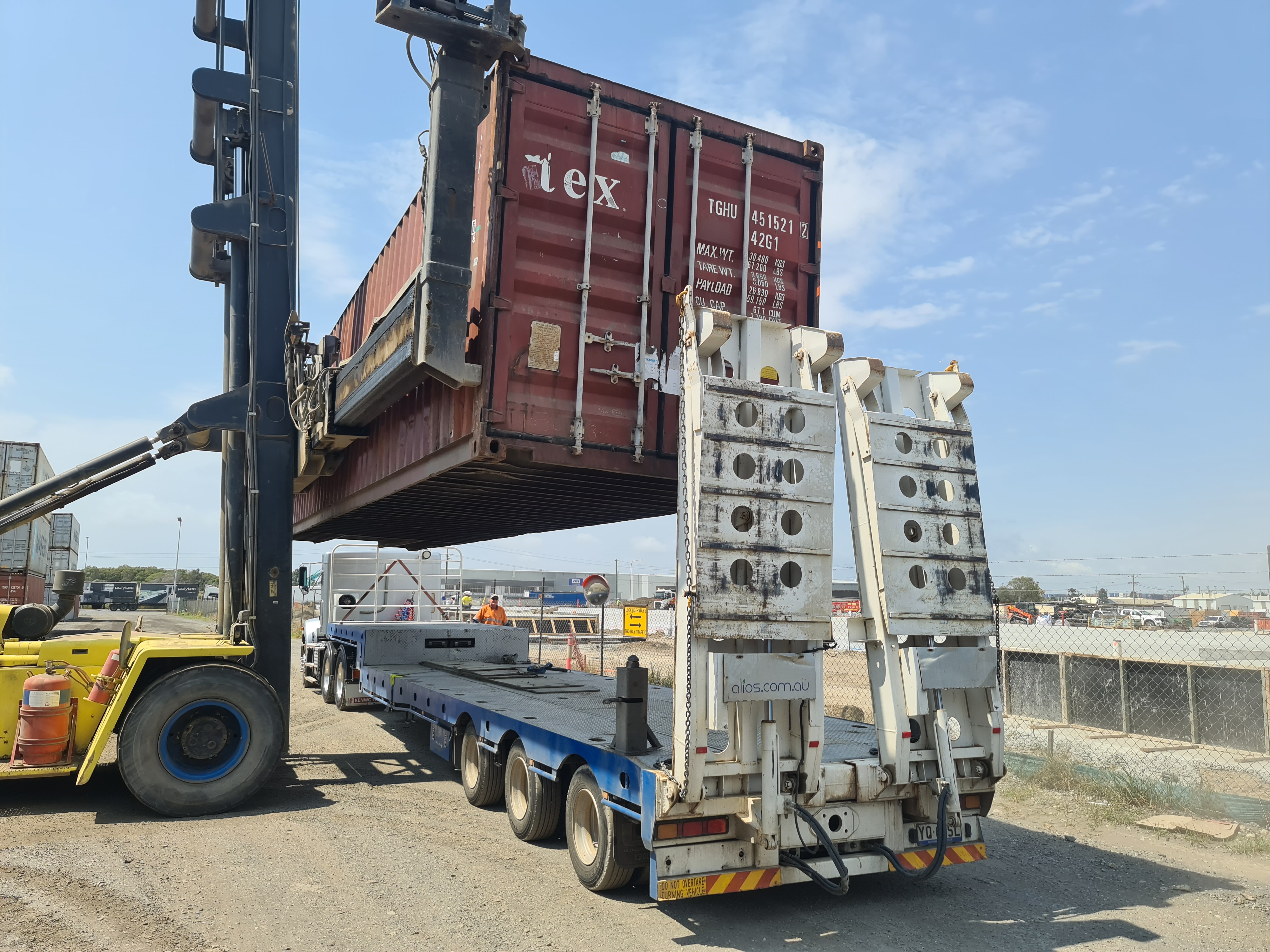 40ft container being lowered onto a truck